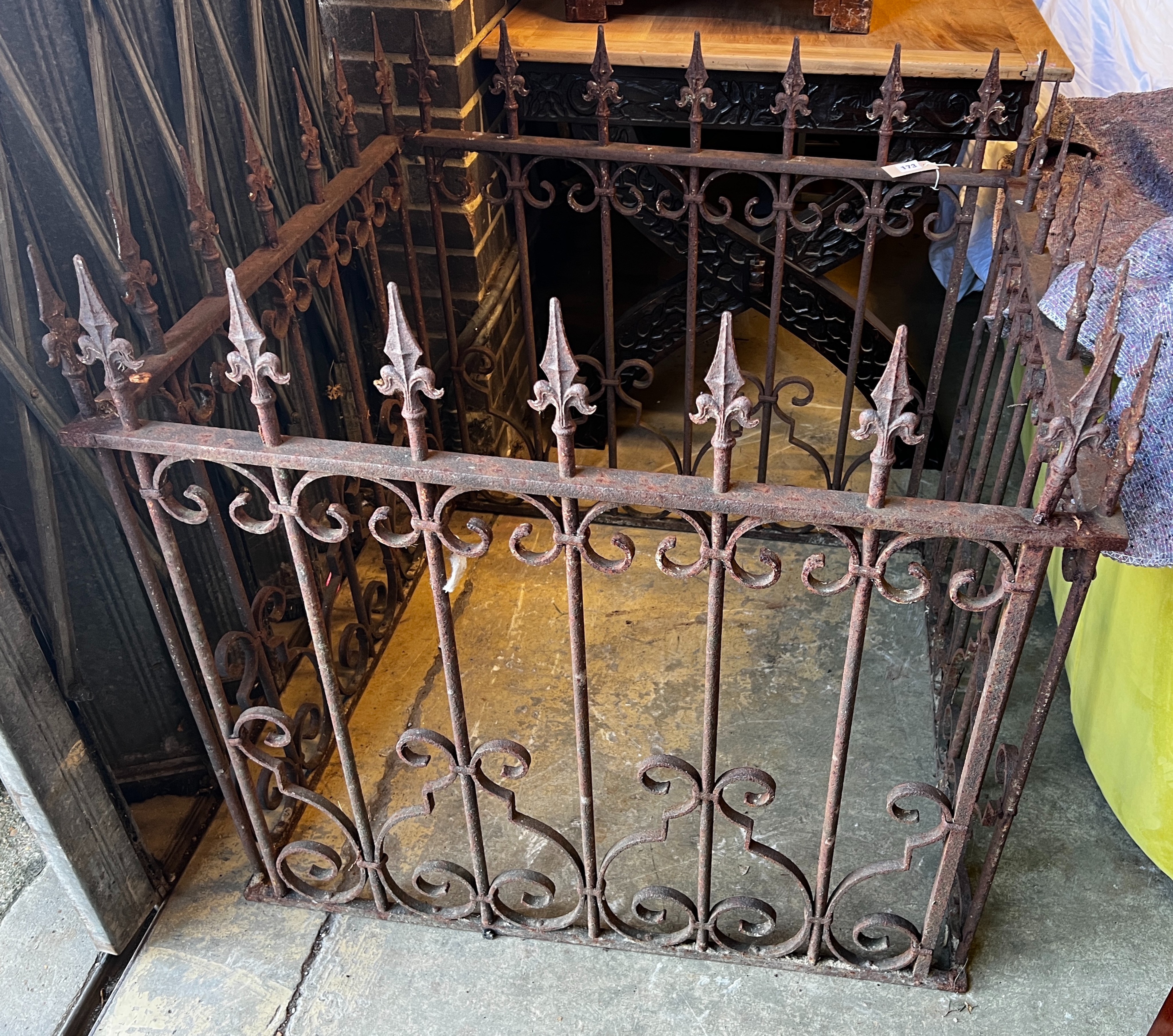 A wrought iron monument surround, width 84cm, depth 92cm, height 85cm